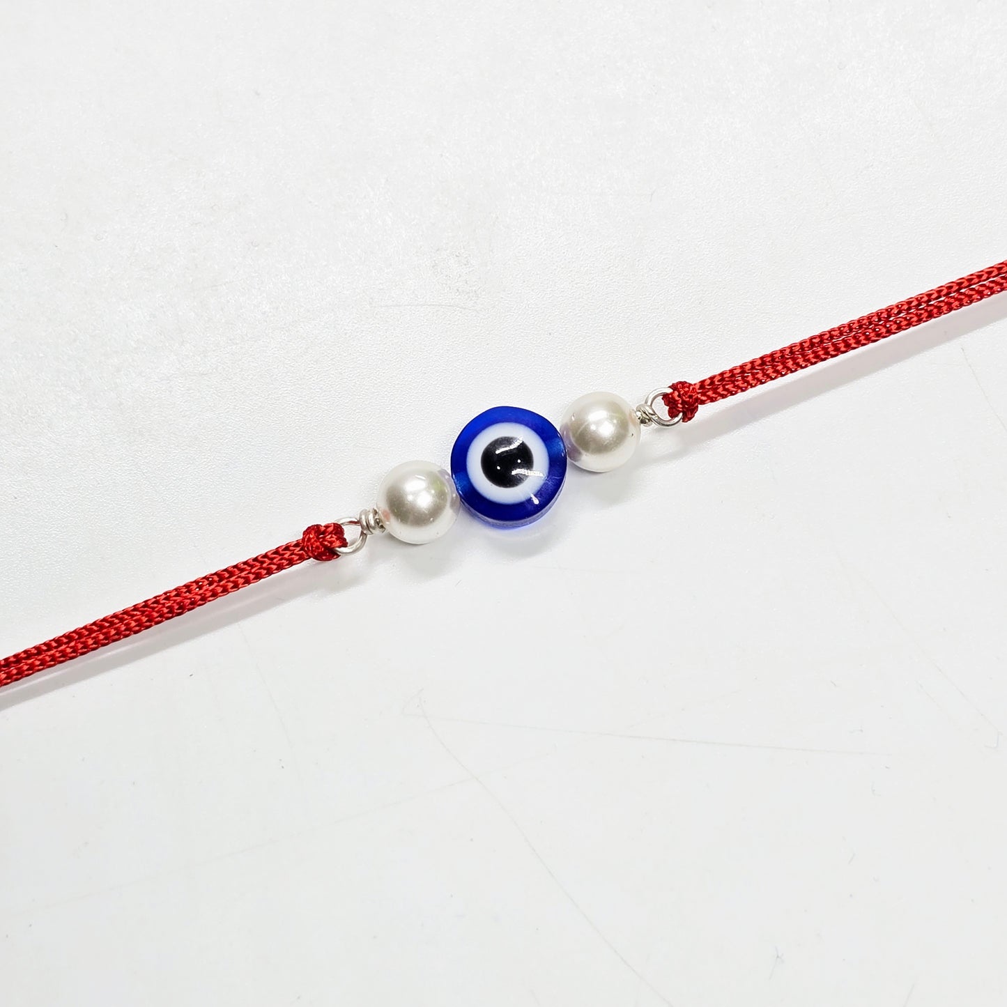 Evil eye with Pearl silver rakhi