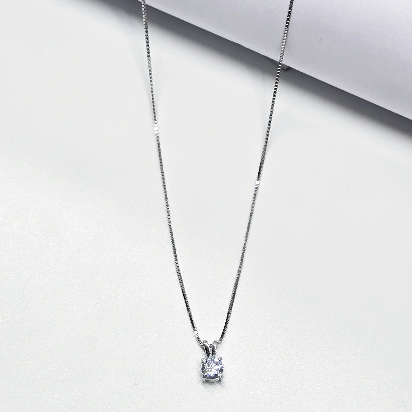 A Smooth Finishing Teen Chain With A Single Diamond Cut Stone Pandant