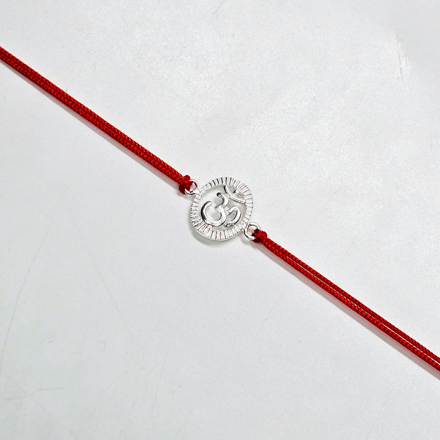 925 PURE SILVER RAKHI WITH THREAD IN "OM" DESIGN