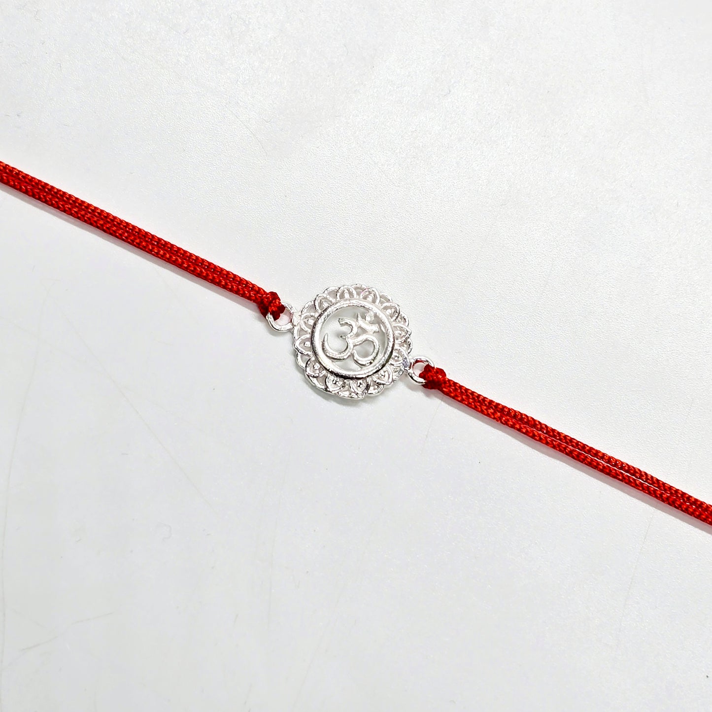 925 PURE SILVER RAKHI WITH THREAD IN "OM" DESIGN